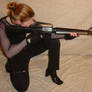 Jodi Crouched Aiming Her Rifle