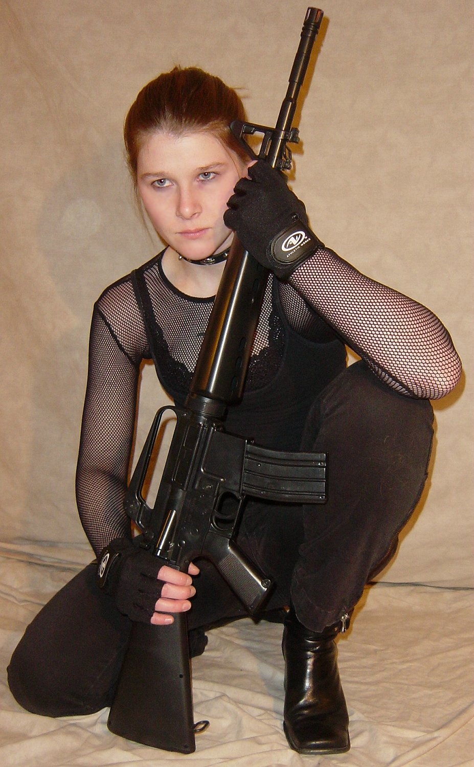 Jodi Crouched Holding Firearm