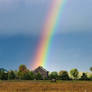 A Beautiful Rainbow over an Old Barn