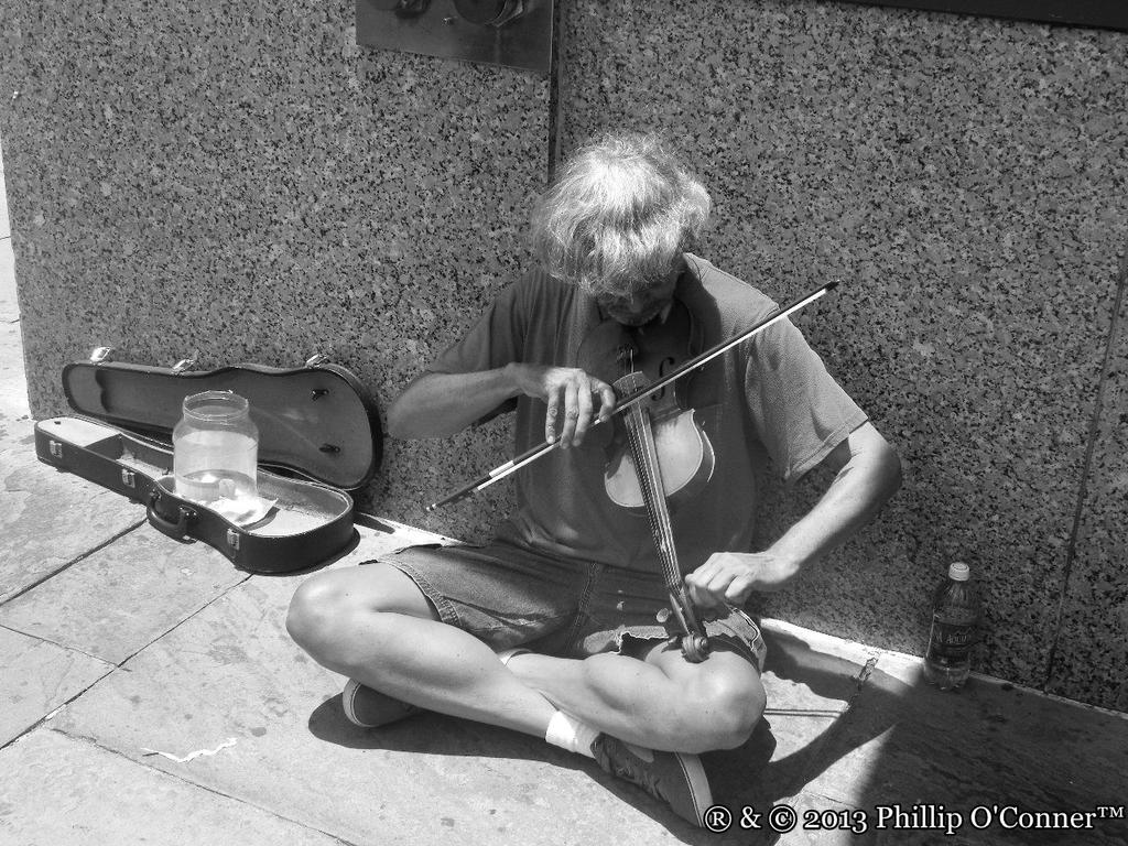 An old Violinist on the Street of Charleston