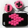 Neon pink Iphone case and headphones