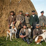 Gamekeepers with dogs in front of a haystack, 1897