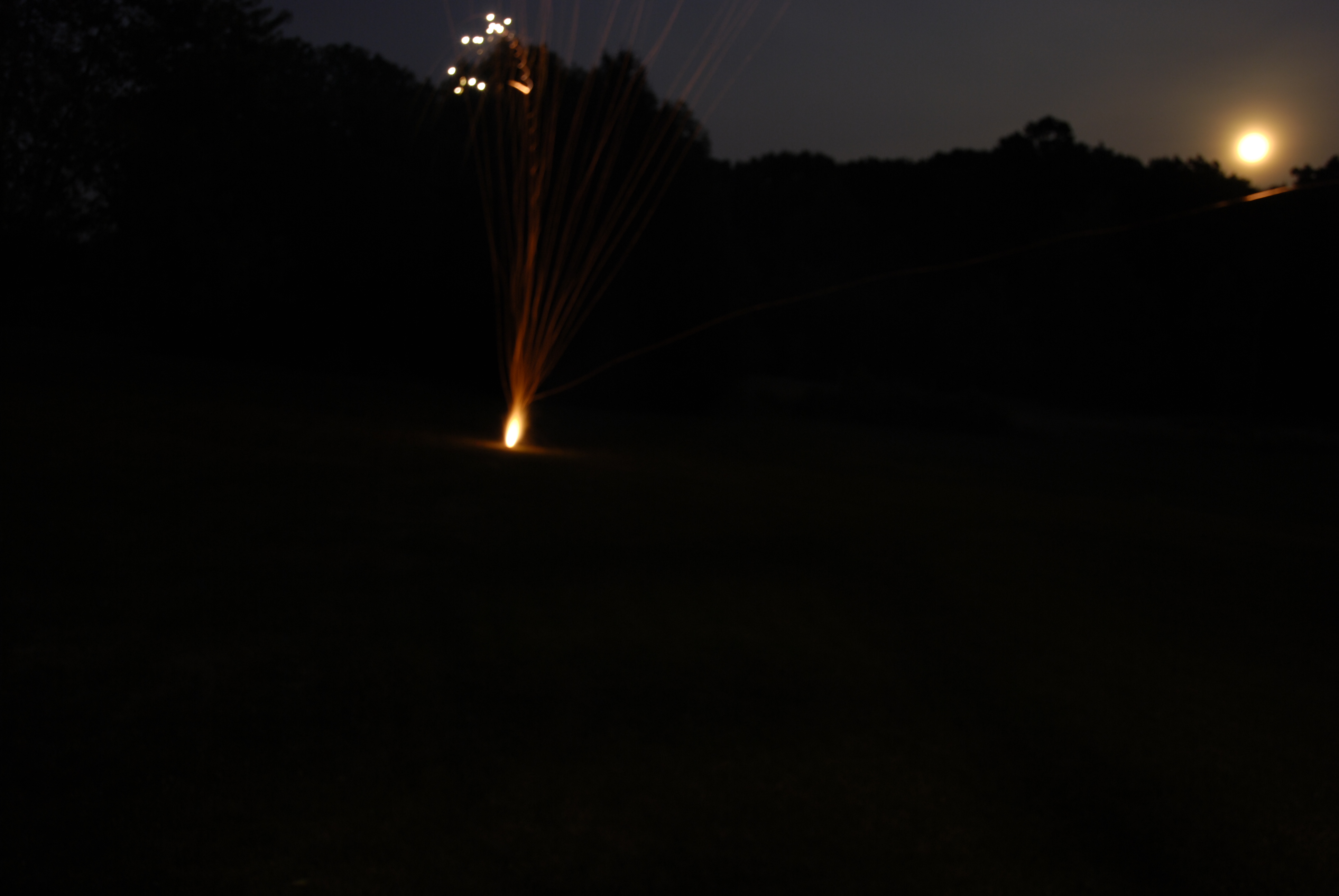 Firework and Moon Rise Stock