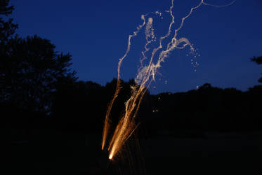 Roman Candle Firework at Dusk Stock