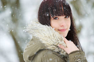 Snowy portrait of a young beauty