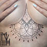 Underboob mandala tattoo