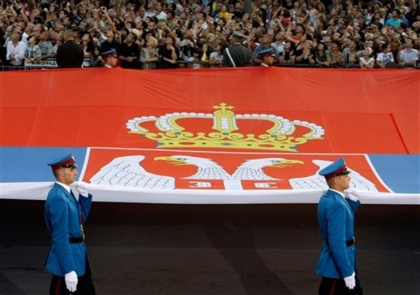 Serbian Guardsmen and their Giant Flag.