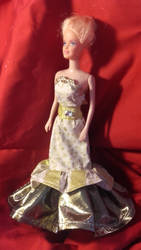 A golden dress for Barbie doll