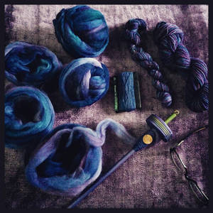 Various stages of the purpley blue yarn