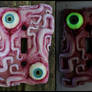 Glow in the dark eyes and tentacles switch plate