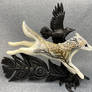 Wolf and raven sculpture