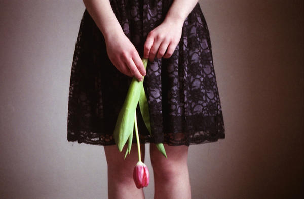 holding the tulip. by BlackDennie