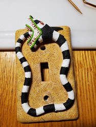 Sandworm light switch cover