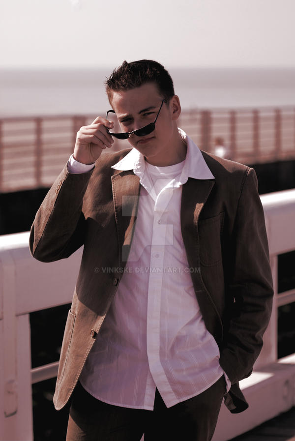 Teen boy posing on peer in suit and sunglasses by Vinkske on