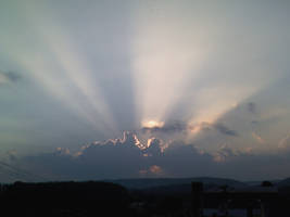 Sunset Behind The Clouds