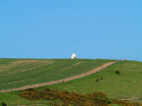 Lighthouse beyond the hill