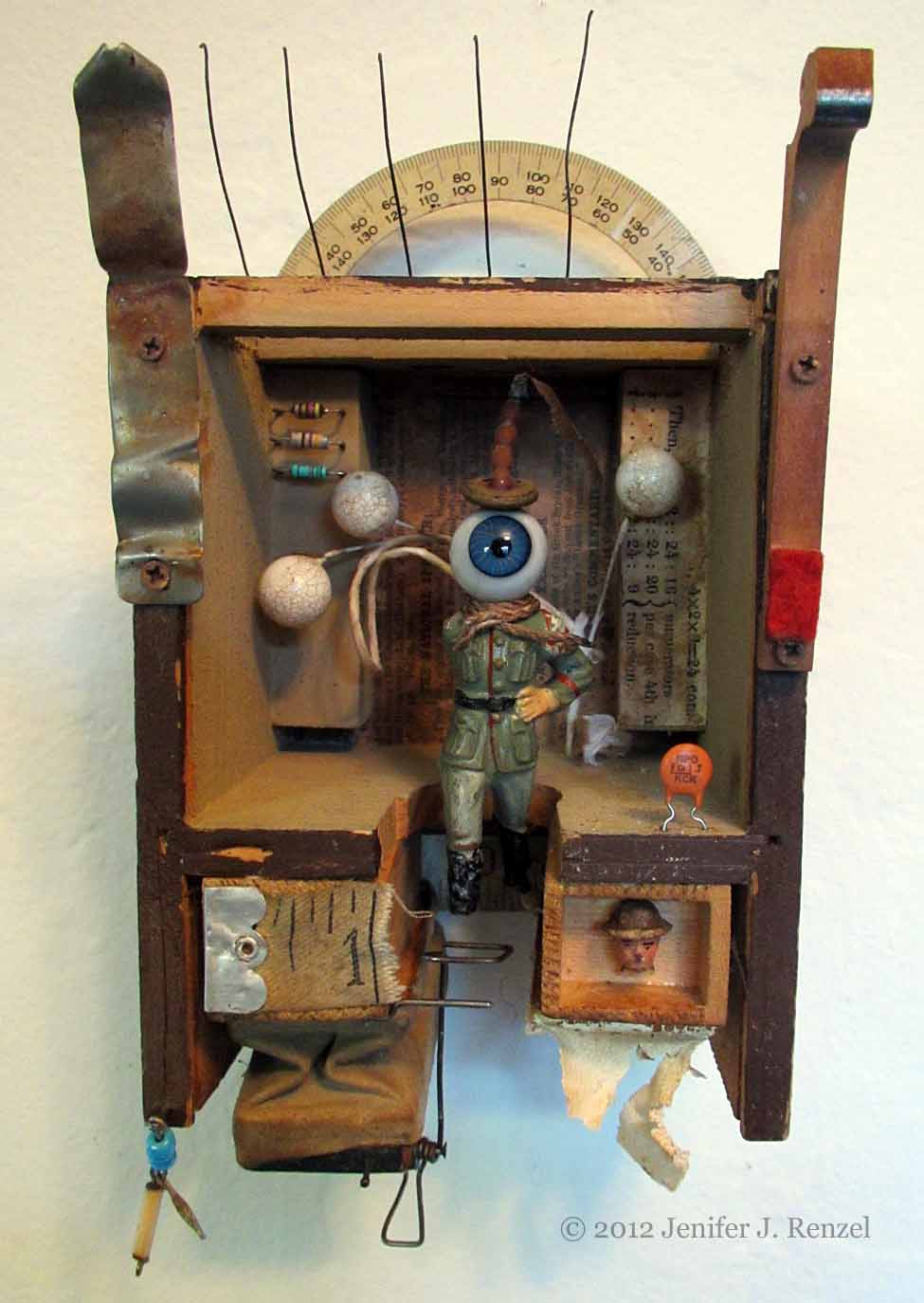 Assemblage: Eyeball Soldier in Clock Case