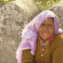 Beggar woman in a purple scarf