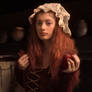 Portrait of a girl with apples and cinnamon