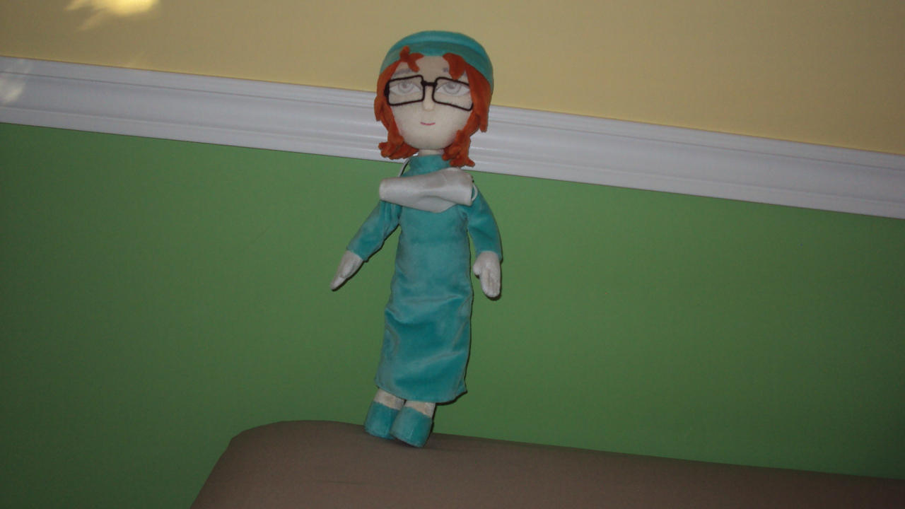 Malory Towers Tori doll wearing surgical garment