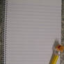 Yellow Pen and Lined Paper