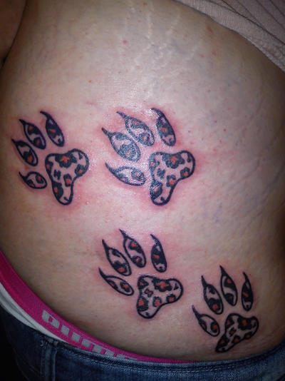 leopard print claws tattoo