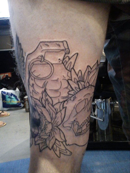 Outline..back of thigh skull tattoo