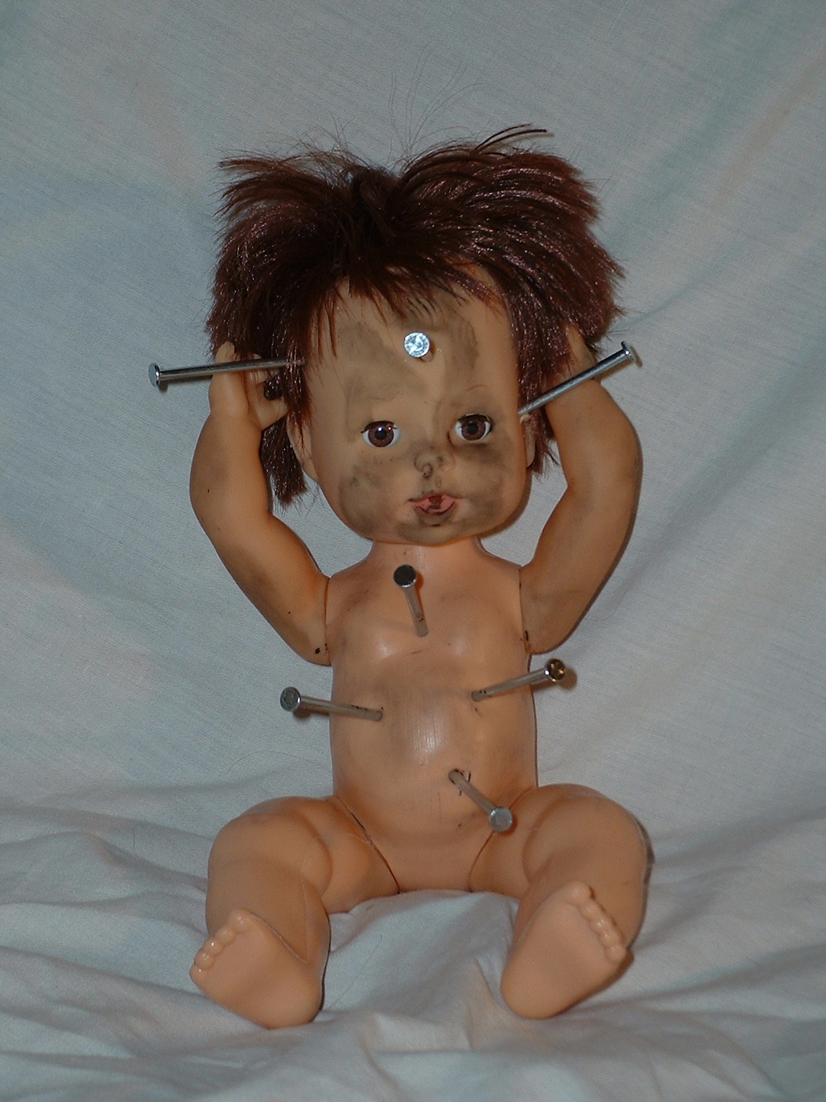 doll with nails in its head 4