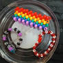 Kandi bracelets I made and a rainbow cuff