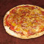 Pizza with ham and peaches