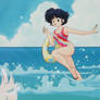 Akana Tendo running in the water in a swimsuit