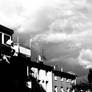 houses and clouds in black and white