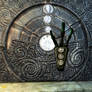 Ancient Nordic puzzle door with dragon claw key