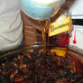 drizzle the rum in the fruitcake mix