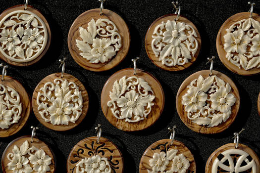 bone medallions on olive tree wood  - detail 3