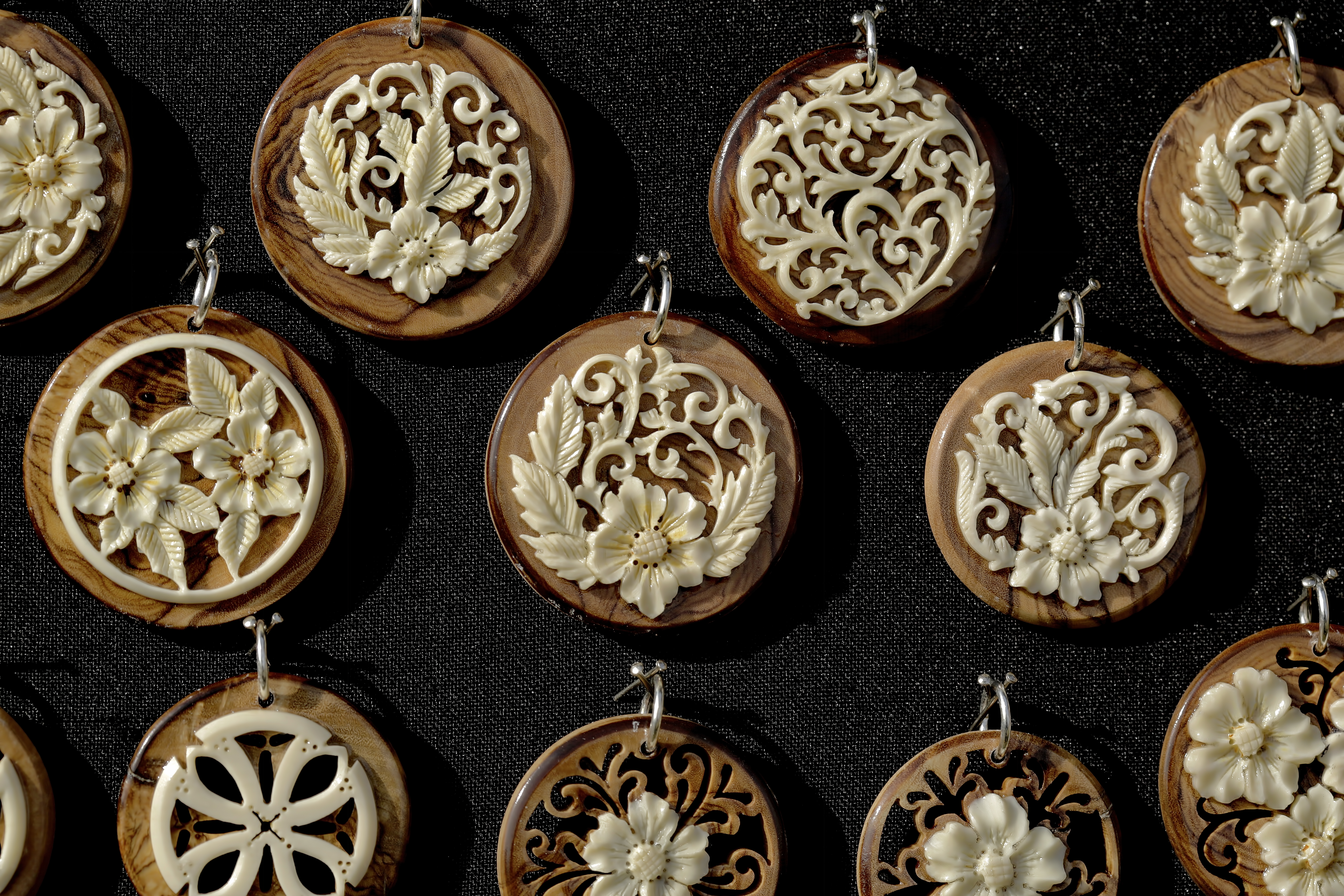 bone medallions on olive tree wood  - detail 4