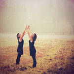 hands held high by Lisa-Schneider