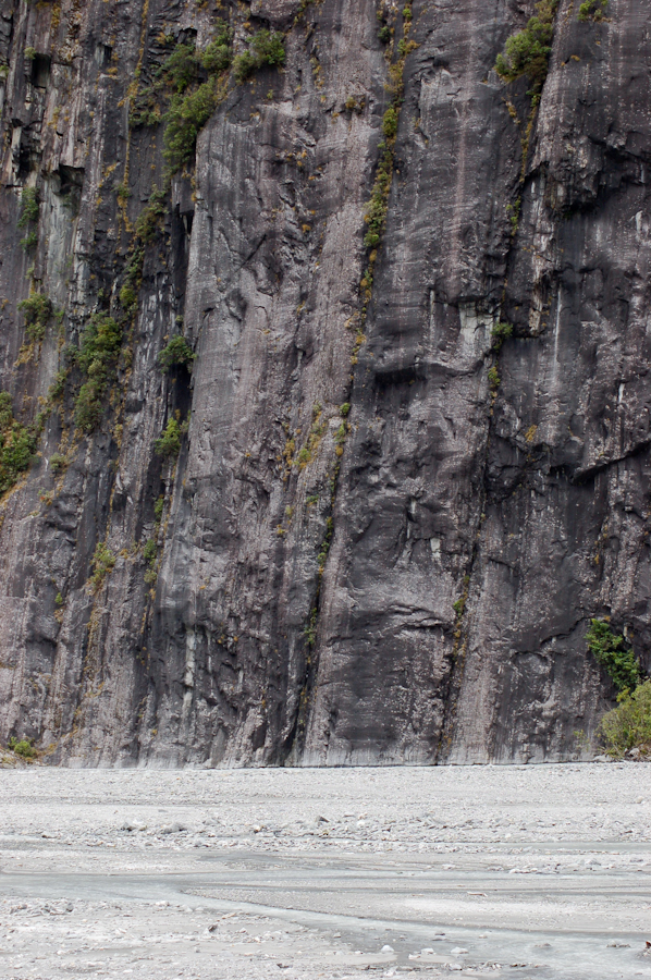 NZ Bottom of sheer cliff