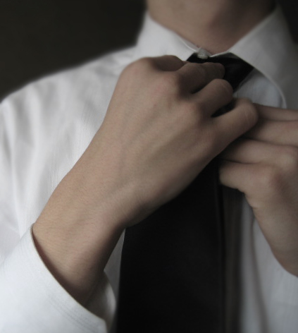 Putting on a tie, what else?