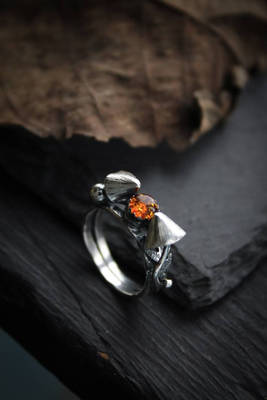 Amber ring with mushrooms 