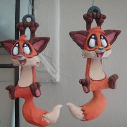 Skitters the Fox ornaments, left and right