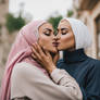 Two women hijab kissing lesbian