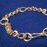 silver and brass bracelet