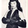 Bettie Page with gloves on