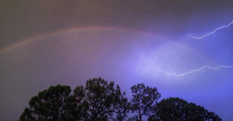 Rainbow with Lightning at Night