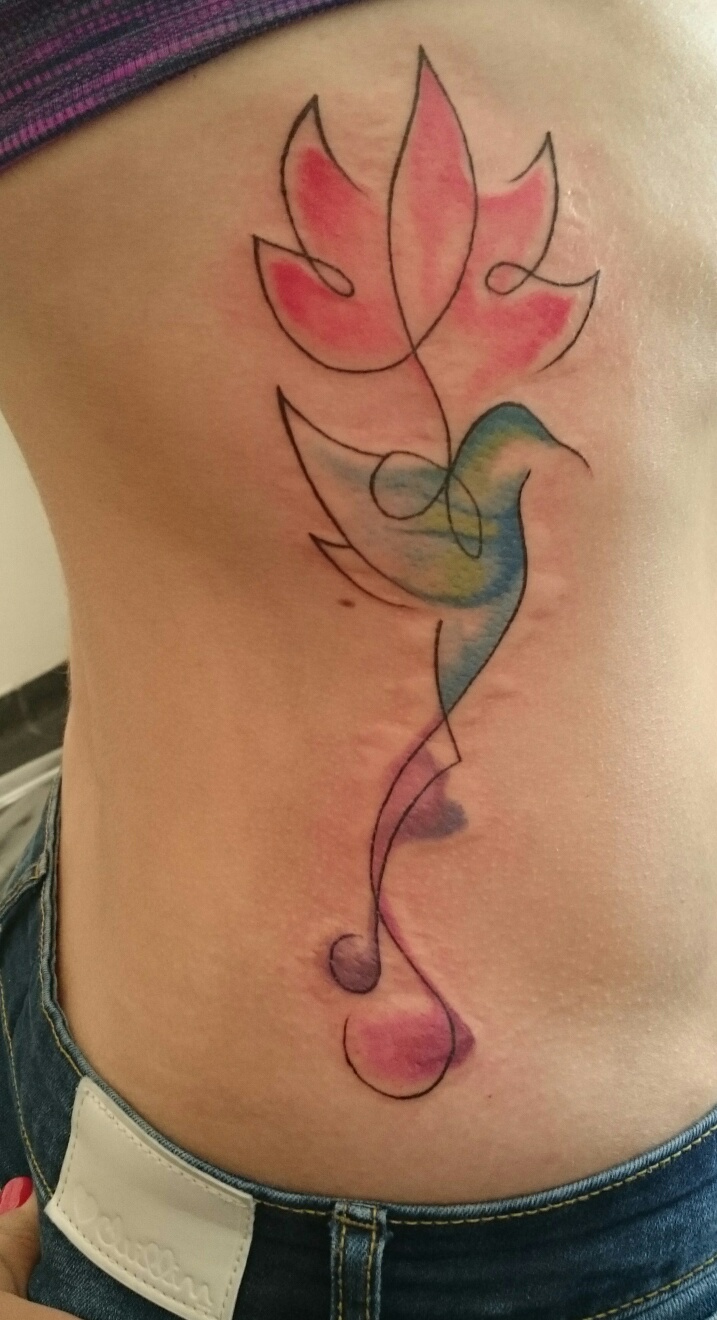 lotus flower and hummingbird watercolor tattoo
