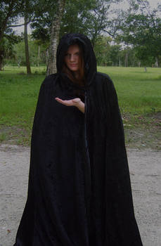 Girl in black cloak -hand out