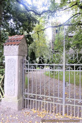 Forged iron gate with walled posts