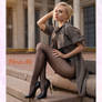Beautiful blonde sitting on stairs in pantyhose
