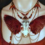 Mink skull necklace with hand-dyed sparrow wings